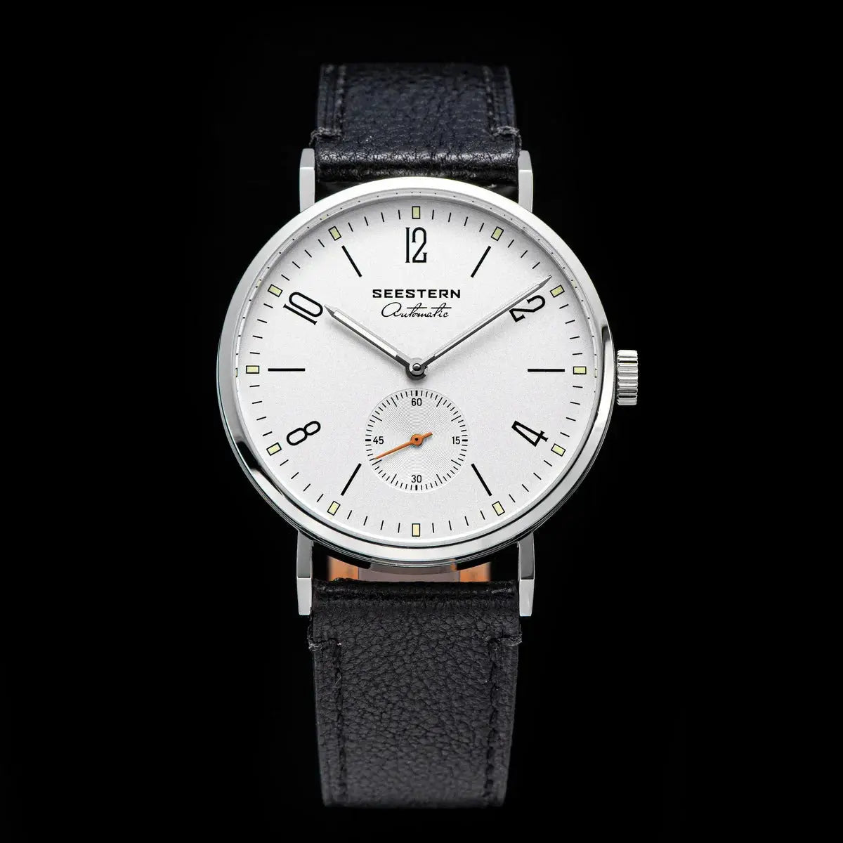 Seestern automatic men's wristwatch with silver case, white dial, and black leather strap; small seconds subdial.