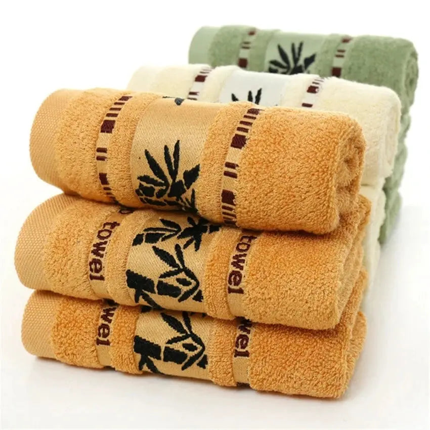 Bamboo fiber towel set in orange, beige and green; includes 34x74 cm and 70x140 cm towels