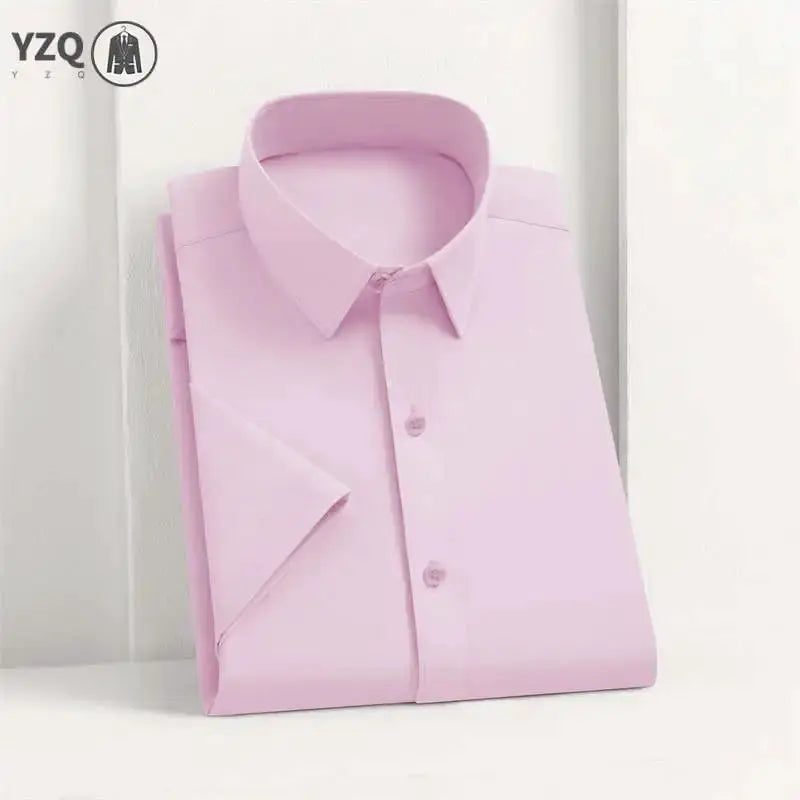 Men's pink solid dress shirt, neatly folded; YZQ logo visible