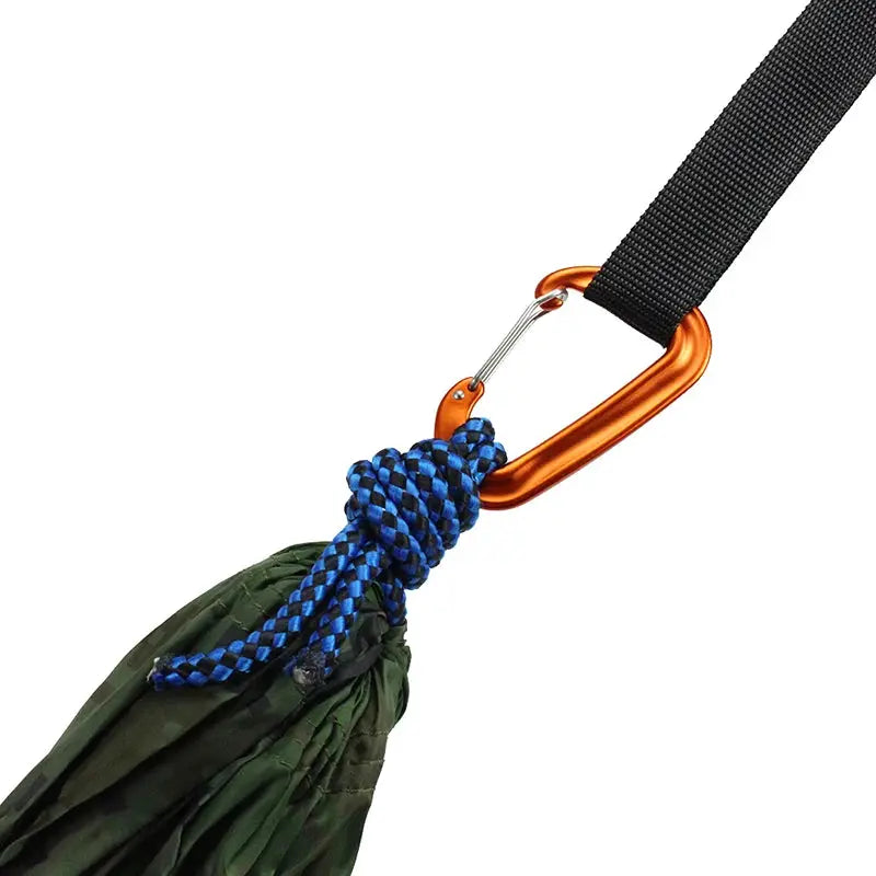 Orange D-shaped climbing carabiner with blue paracord tassel attached to black strap