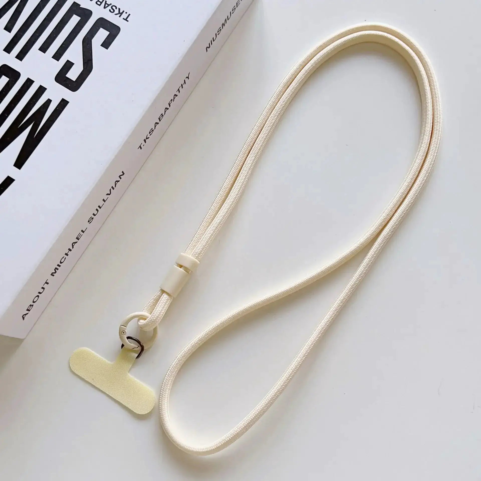 Phone lanyard in ivory braided rope with clip; adjustable crossbody strap by Simples Market