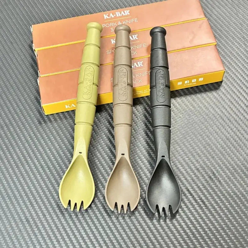 Tactical mini cutlery set, 3-piece spork-style tools in olive, tan and black with KA-BAR packaging in background