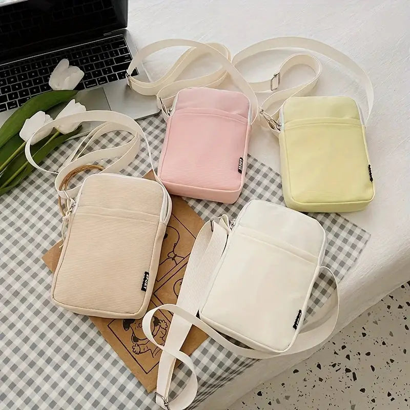 Simples Market shoulder messenger bags: five pastel crossbody phone bags in beige, pink, peach, white and yellow.