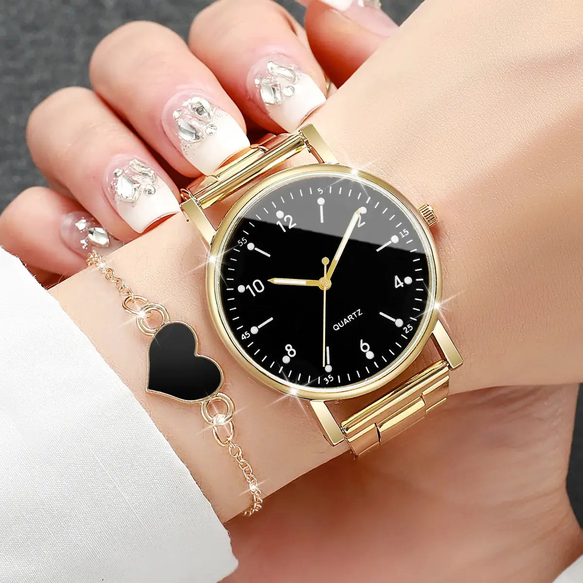 Simples Market women's gold-tone quartz watch with black Arabic-dial; includes 2 bracelets