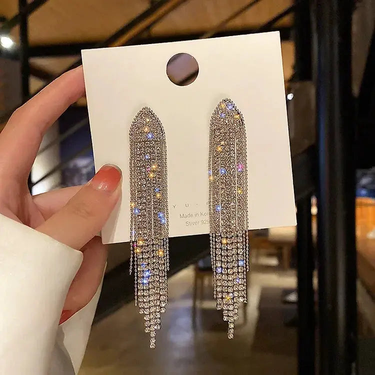 Pair of punk geometric zinc alloy fringe chandelier earrings by Simples Market with clear crystals, silver tone
