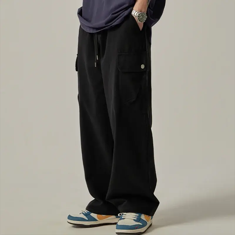 Men's black cargo sweatpants, wide-leg with large pockets and drawstring waist.