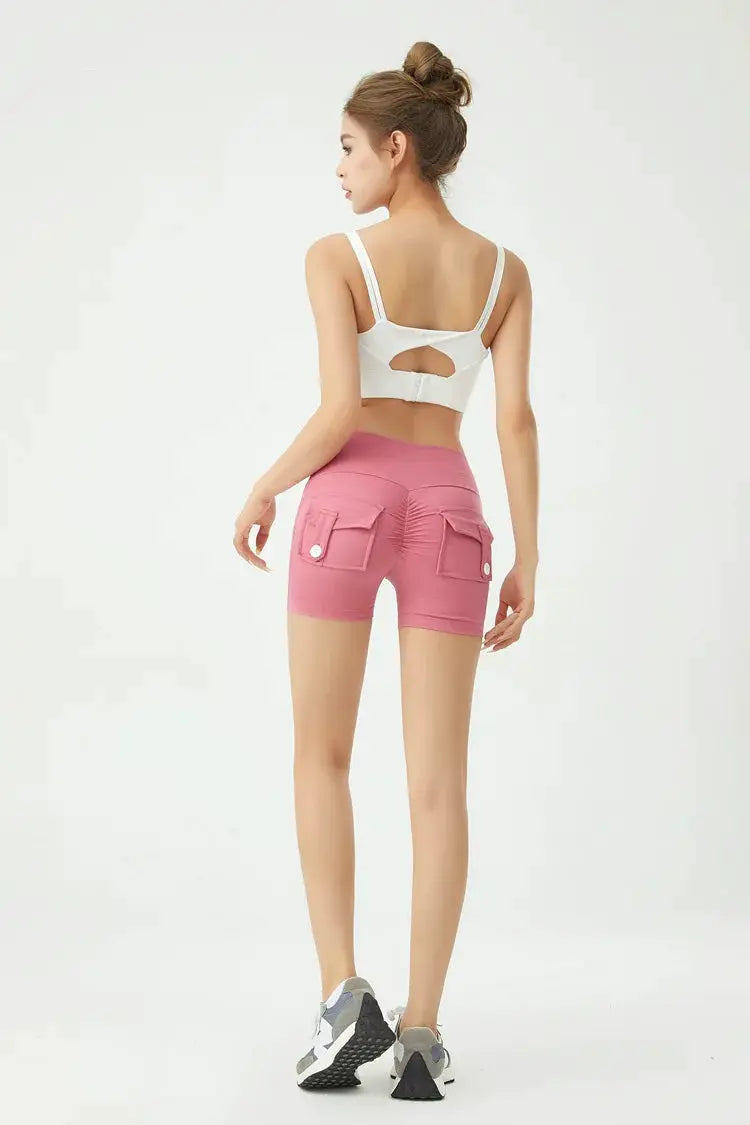 Women's peach cargo fitness shorts with back pockets, air-dry fabric