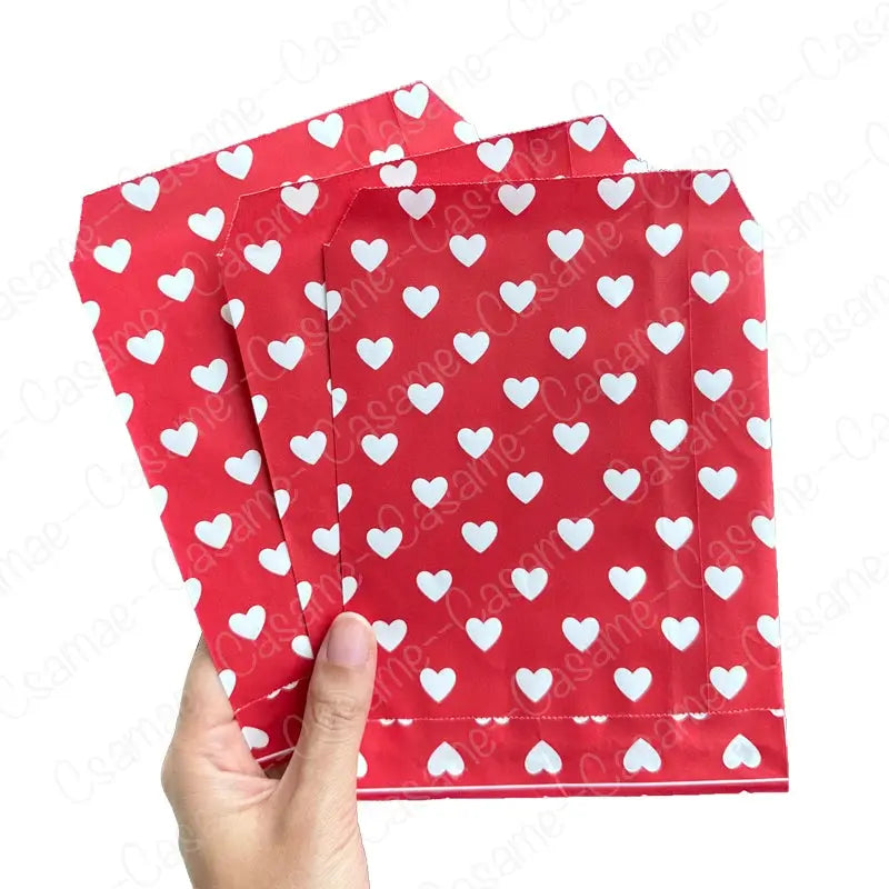 Gift bags: 25 red heart-pattern paper bags, 13x18 cm for Valentine’s Day events