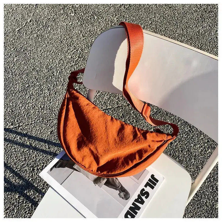 Casual nylon hobo crossbody bag for women in orange with adjustable strap and large capacity