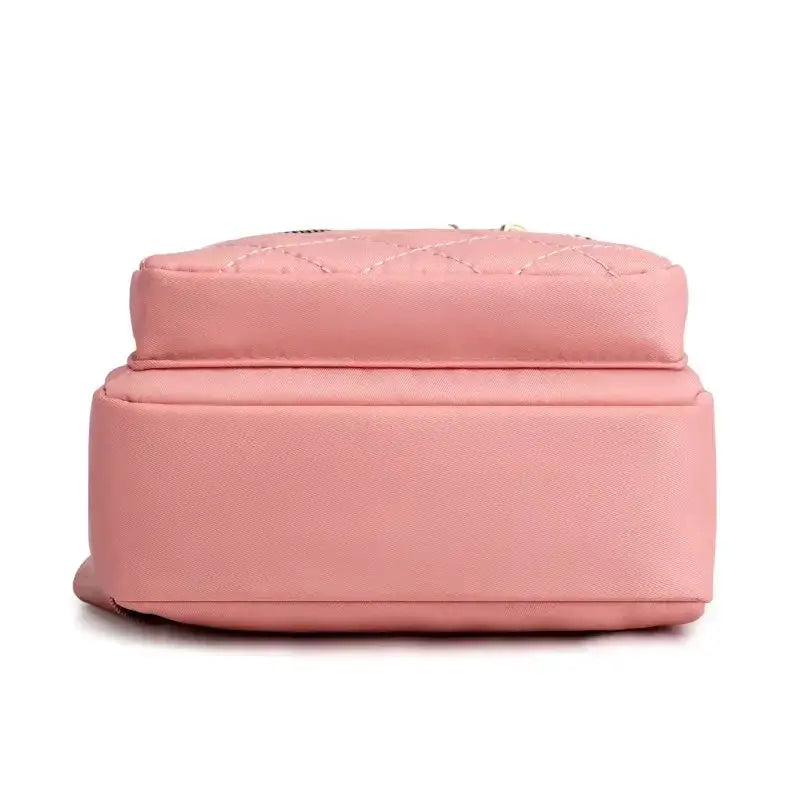 Pink diamond-quilted shoulder bag in composite fabric, compact handbag for ladies