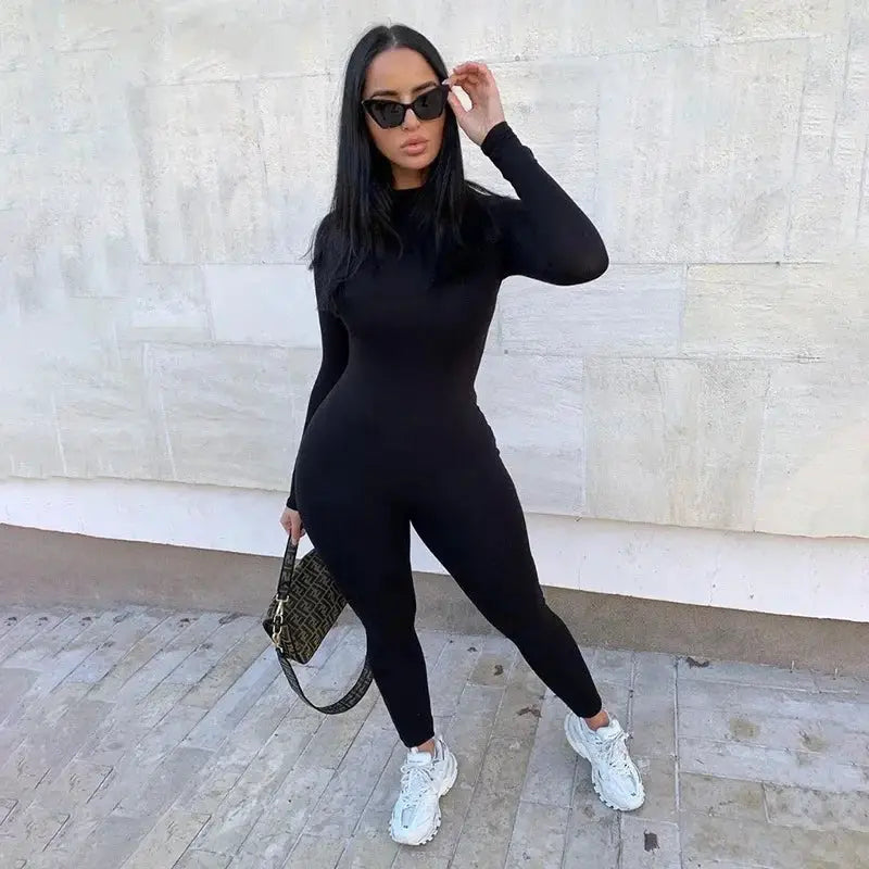 Women's solid black long-sleeve jumpsuit, form-fitting athletic streetwear