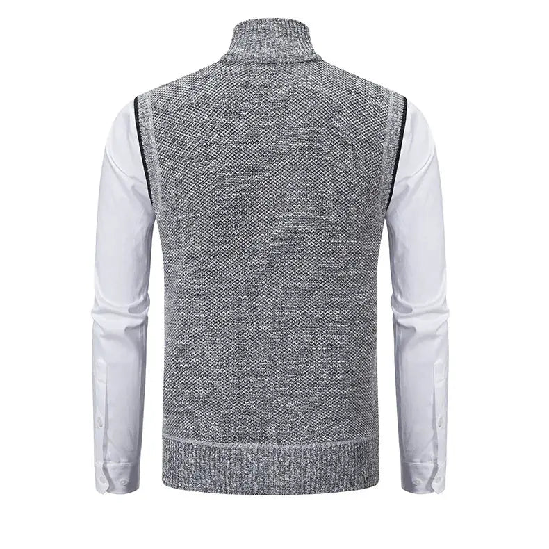Men's knitted sleeveless sweater vest in grey over a white shirt with a ribbed hem and stand collar