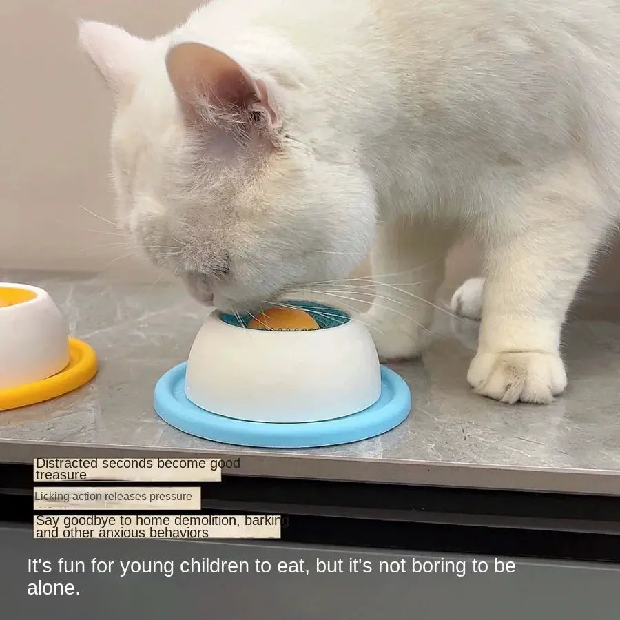 Simples Market Lick Toy slow feeder for pets; blue base, white lid, orange center, cat licking.
