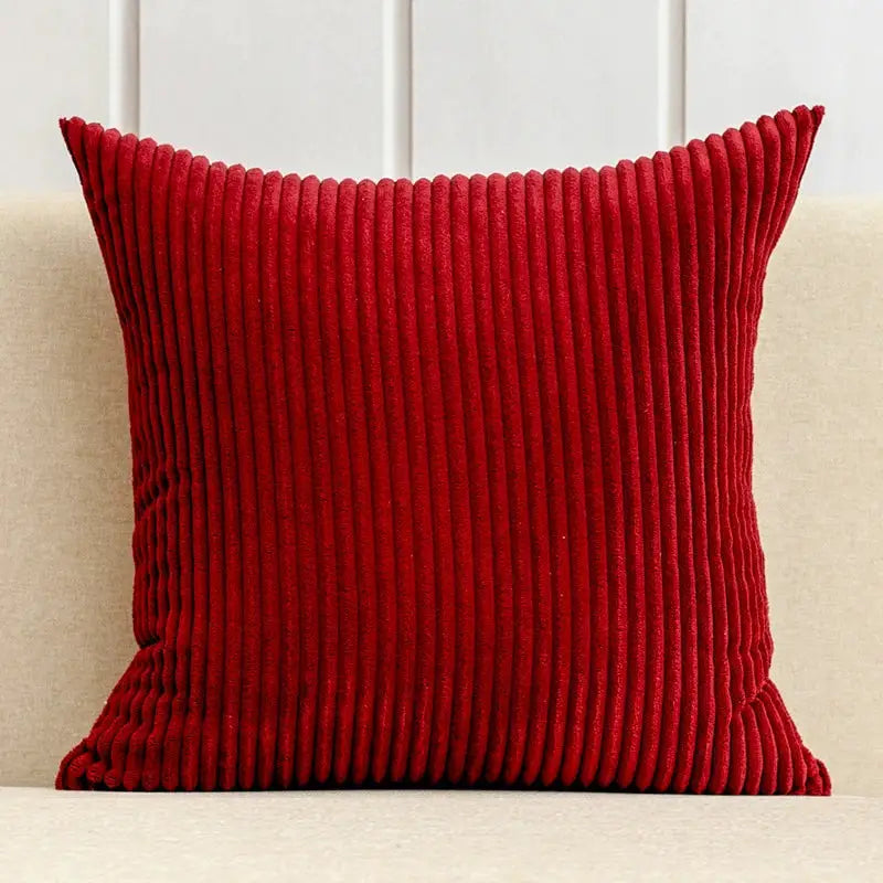 Corduroy striped cushion cover in red, 30x50/40/45/50/55/60cm, on beige sofa.