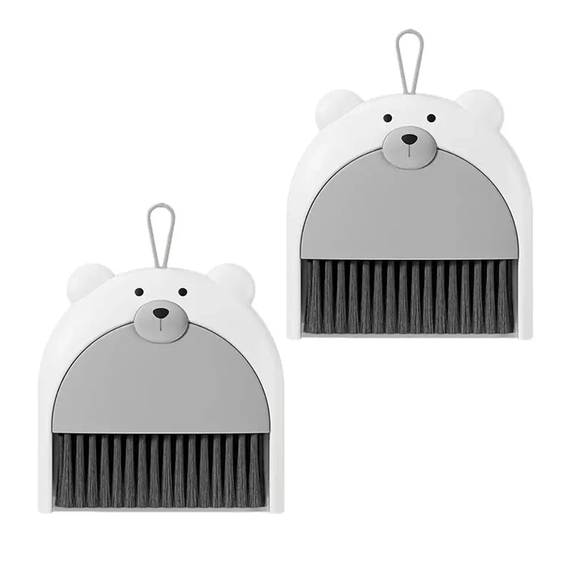 Bear-shaped broom and dustpan set, 2-pack by Simples Market, white with gray dustpan and black bristles.