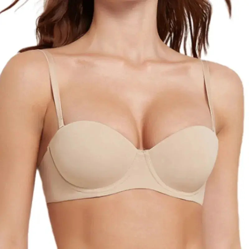 Beige seamless women's bra with molded cups and adjustable straps