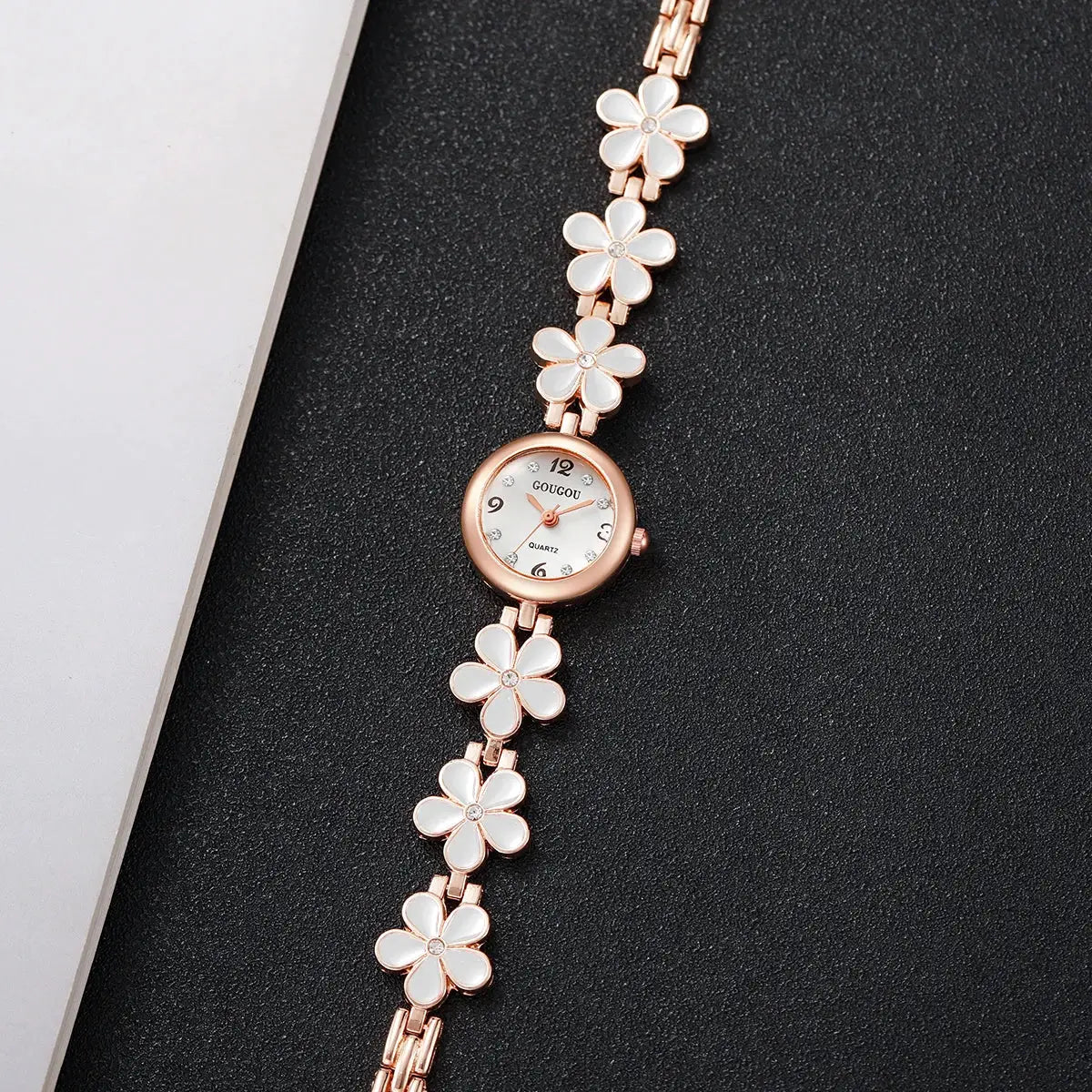 Flower-bracelet watch for women by GOUGOU, rose-gold with white enamel petals and crystal accents, quartz