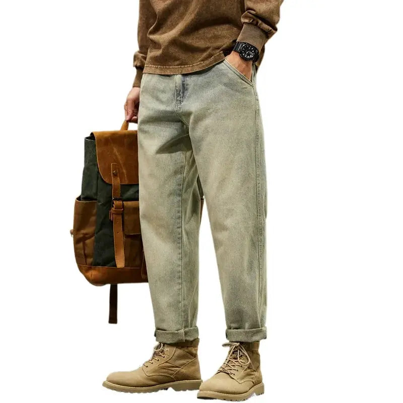 Men's loose baggy denim jeans in light olive, 95% cotton with rolled cuffs