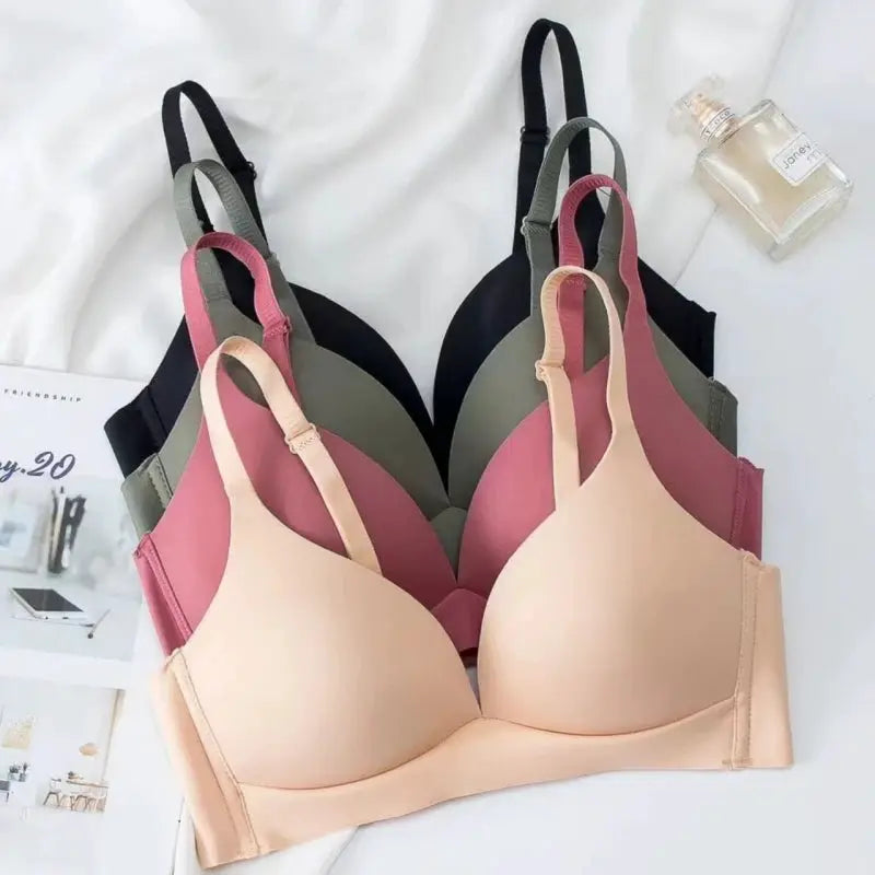 Set of 5 seamless wireless push-up bralettes in nude, pink, sage green, mauve, and black