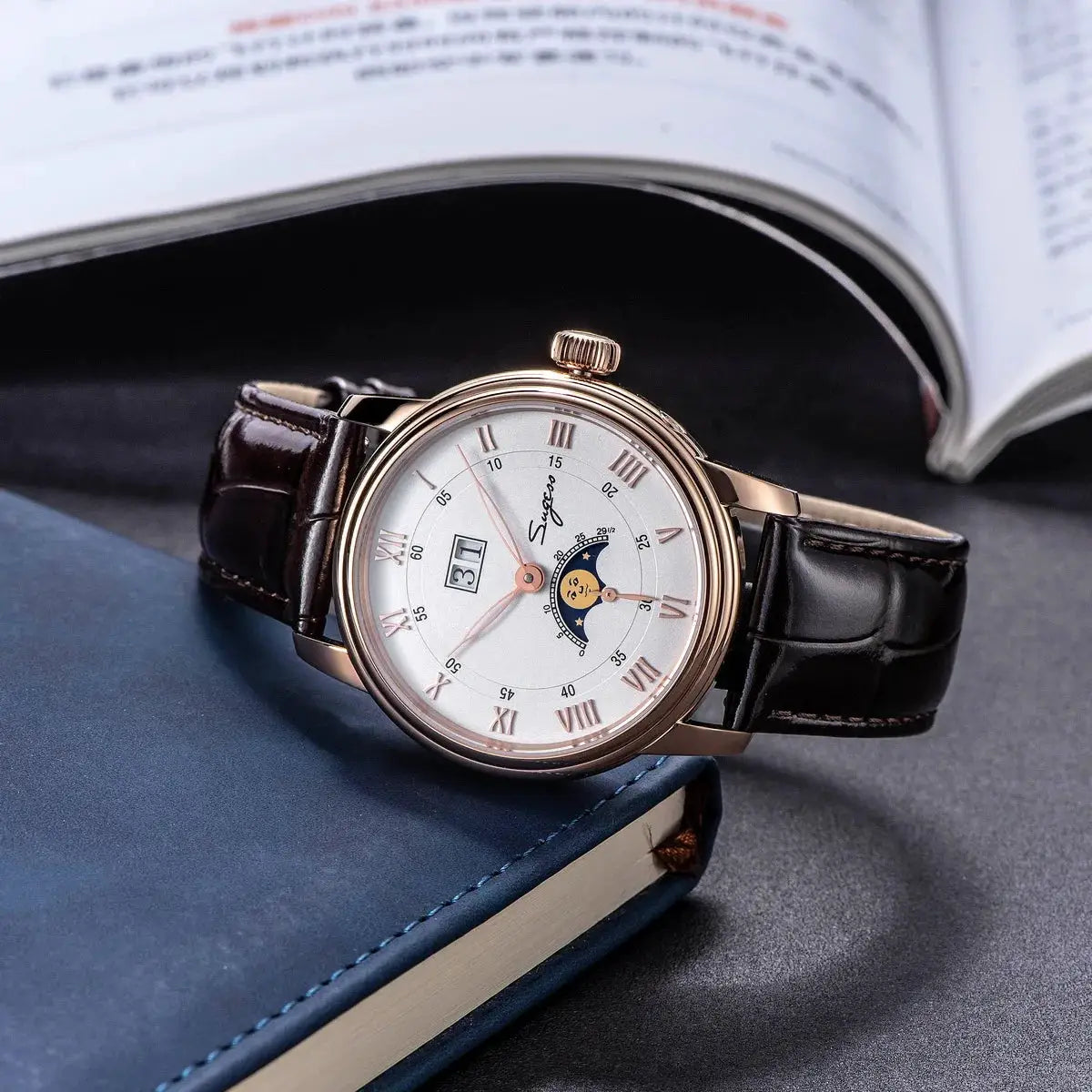 Sugess Moonphase mens wristwatch - rose gold case, white dial with Roman numerals, brown leather strap.