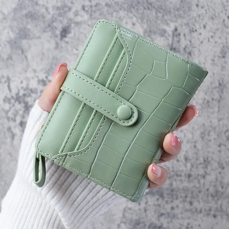 Mini crocodile print clutch wallet in mint green with card slots by Simples Market