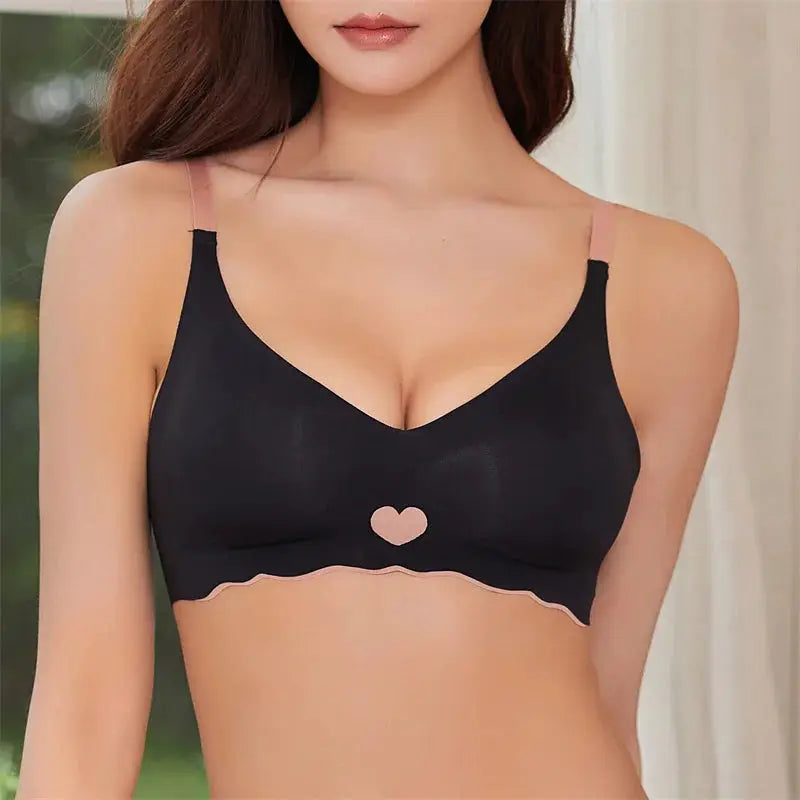 Women seamless bralette in black with pink adjustable straps, heart center and pink wavy trim