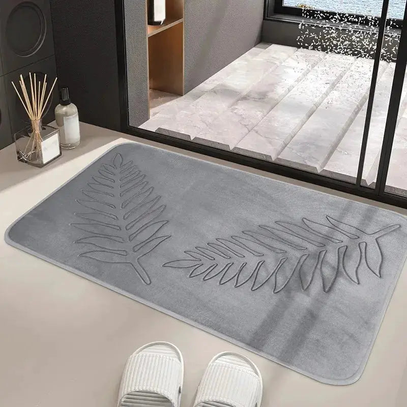 3-Piece memory foam bathroom mat set in gray with leaf design