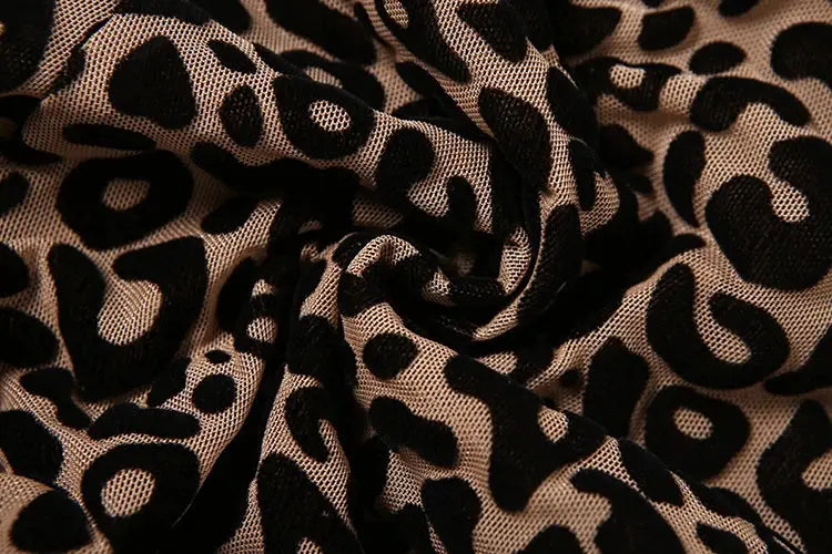 Nibber see-through leopard mesh jumpsuit fabric close-up; beige background with black spots, Simples Market