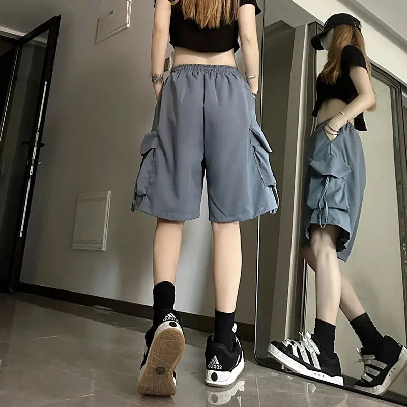 ZOKI women high-waist cargo shorts in gray with large side pockets, wide-leg loose fit