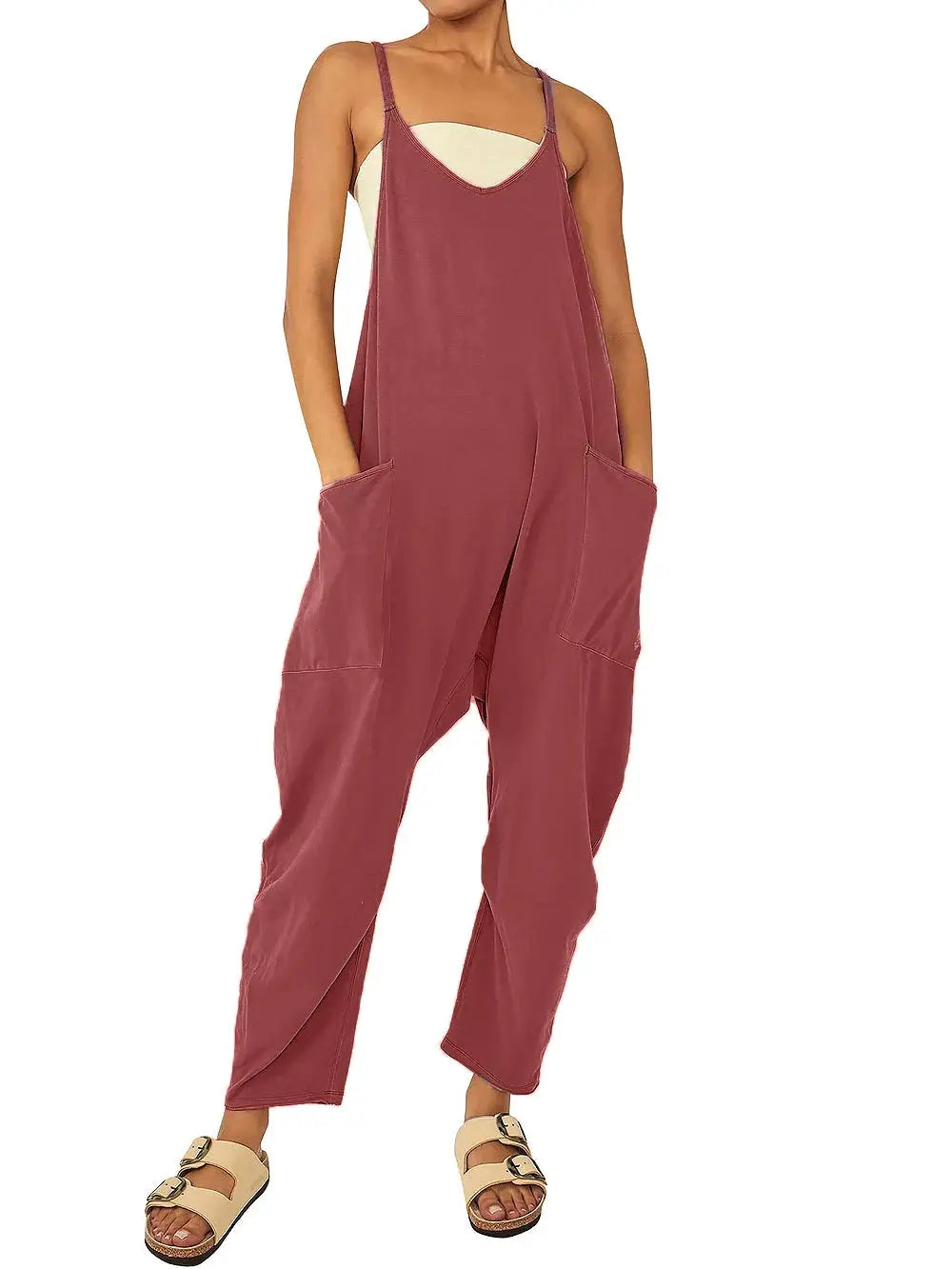 Women's loose burgundy jumpsuit with suspender straps and oversized patch pockets.