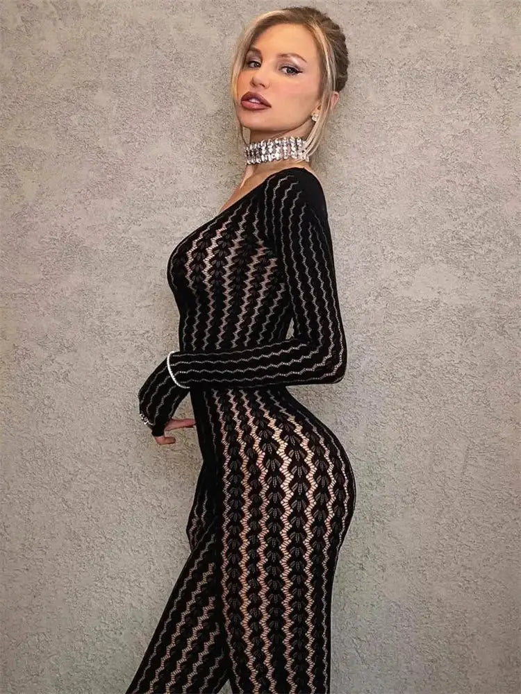 Tossy see-through black lace jumpsuit by Simples Market; sheer long-sleeve, body-hugging fit.
