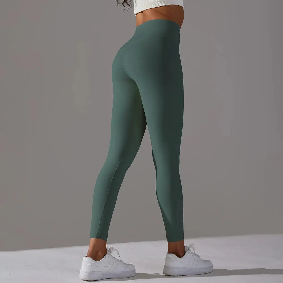 High-waist teal-green leggings for women, ideal for fitness, yoga and running.