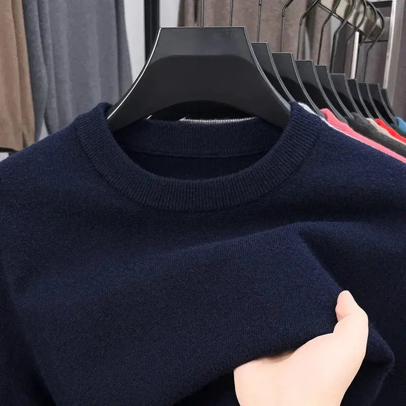 Men's navy round-neck knitted sweater on hanger