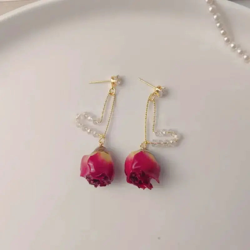 Red rose epoxy resin drop earrings with gold-tone chain and clear crystal beads (pair)