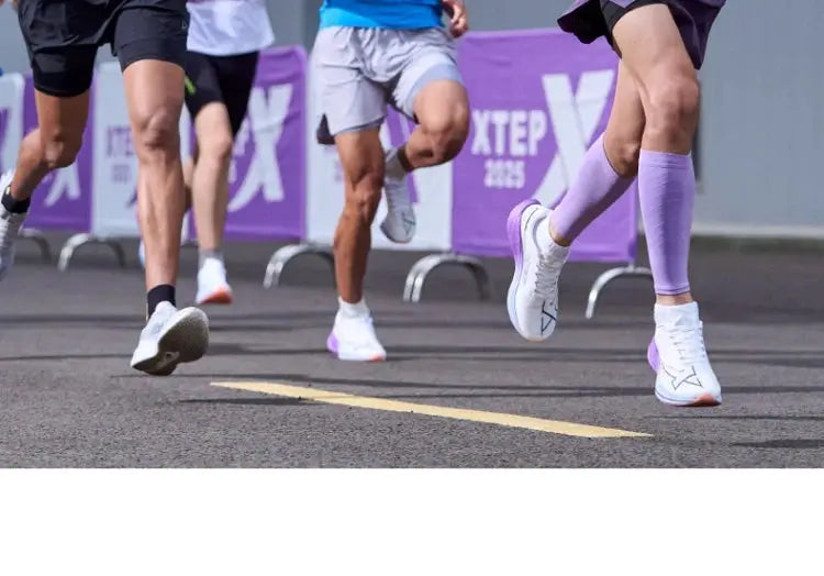 Xtep Shyft 1.0 men's running shoes, white with lavender accents, on 4 runners at a race