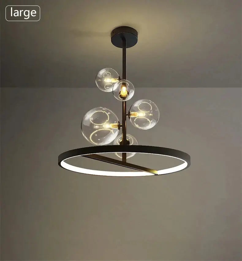 Modern art glass chandelier featuring a brass circular LED ring and multiple clear glass globes.