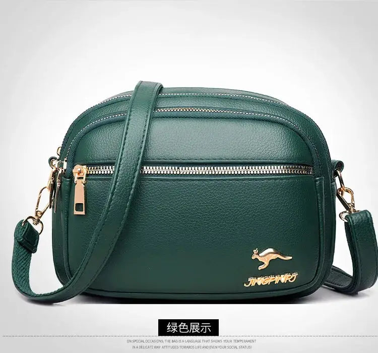Leather shoulder bag by Simples Market in green with gold hardware and crossbody strap