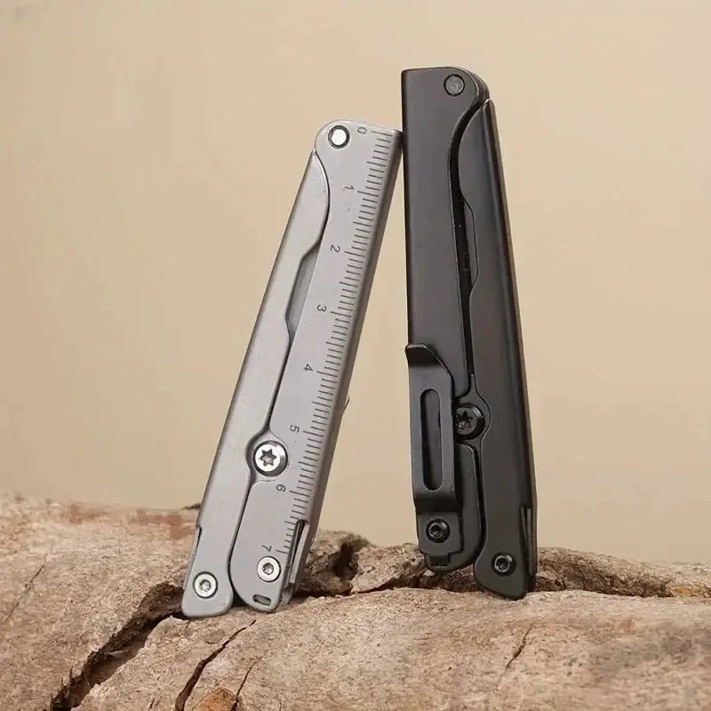 Portable folding scissors multitool; two compact tools shown, one with a stainless steel ruler