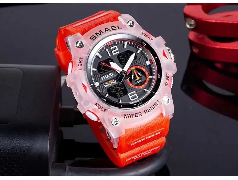 SMAEL sport watch with orange strap and translucent pink bezel, analog-digital dial, dual-time display, water resistant.