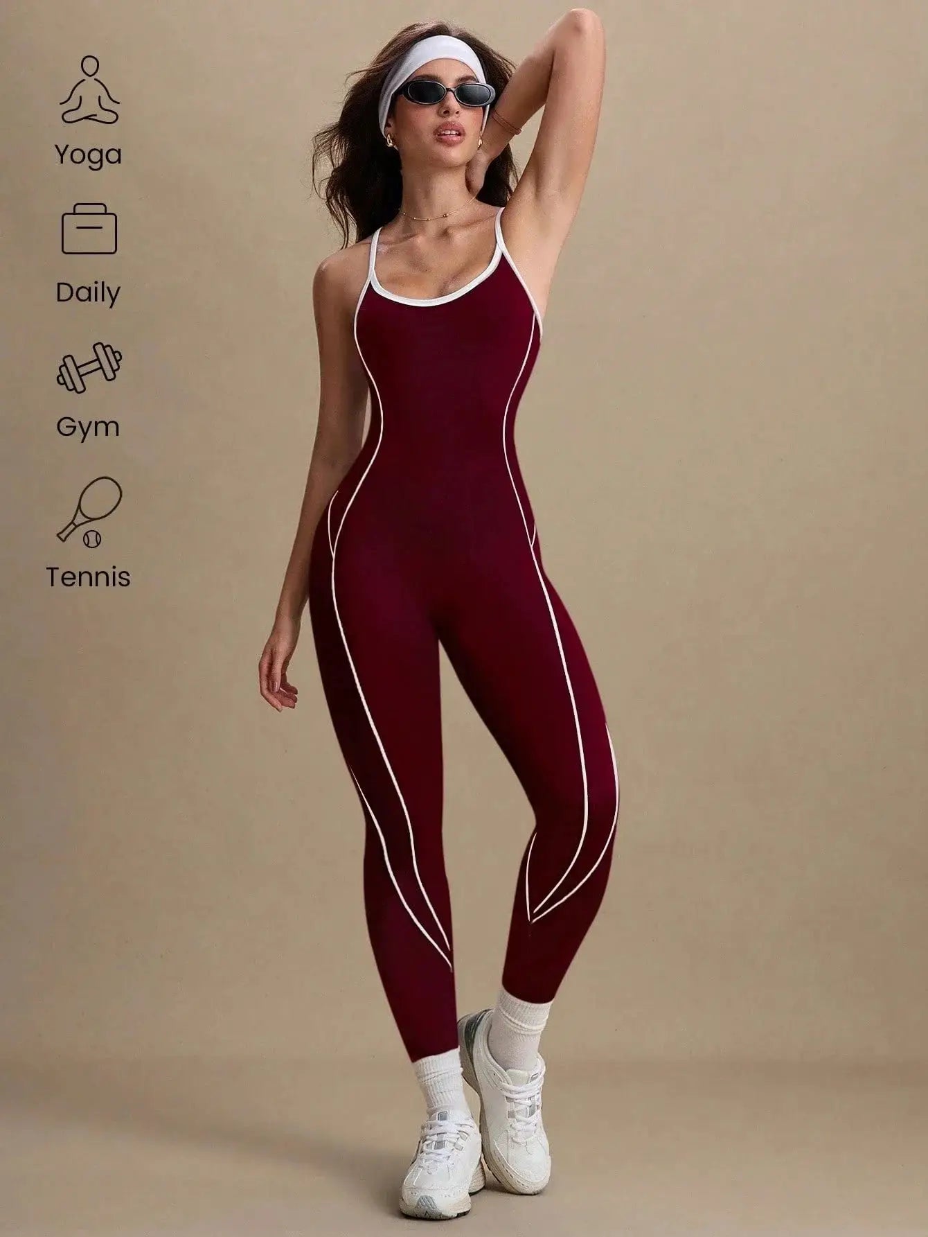 Women’s seamless yoga jumpsuit in maroon with white piping; full-length gym bodysuit.