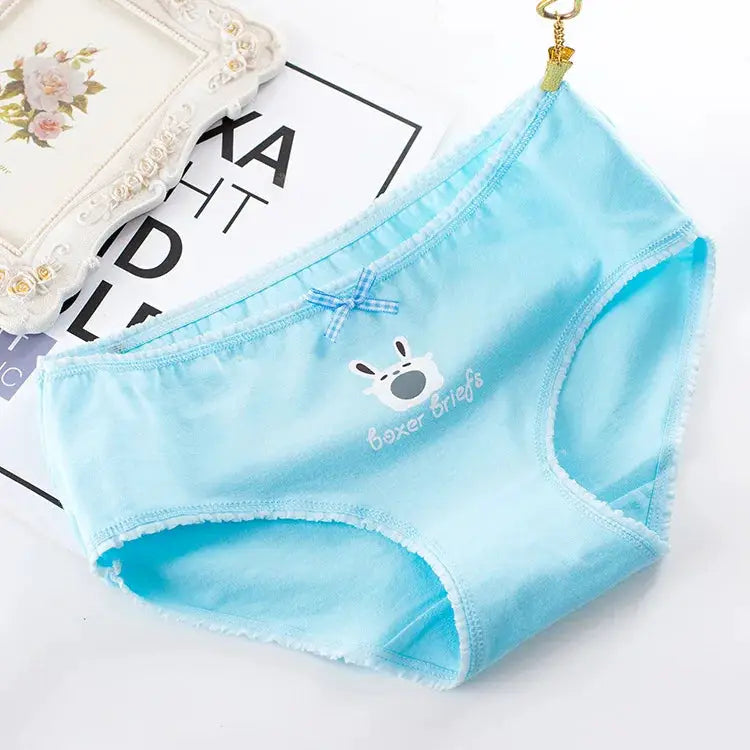 One pair of light blue cotton seamless women's panties with a small bow and cartoon print