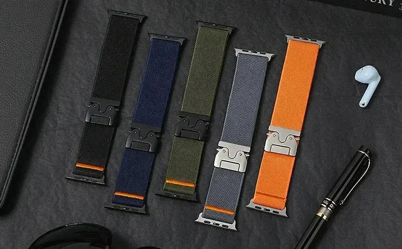 Braided elastic nylon Apple Watch Ultra 2 bands: five in black, navy, olive, gray, orange.