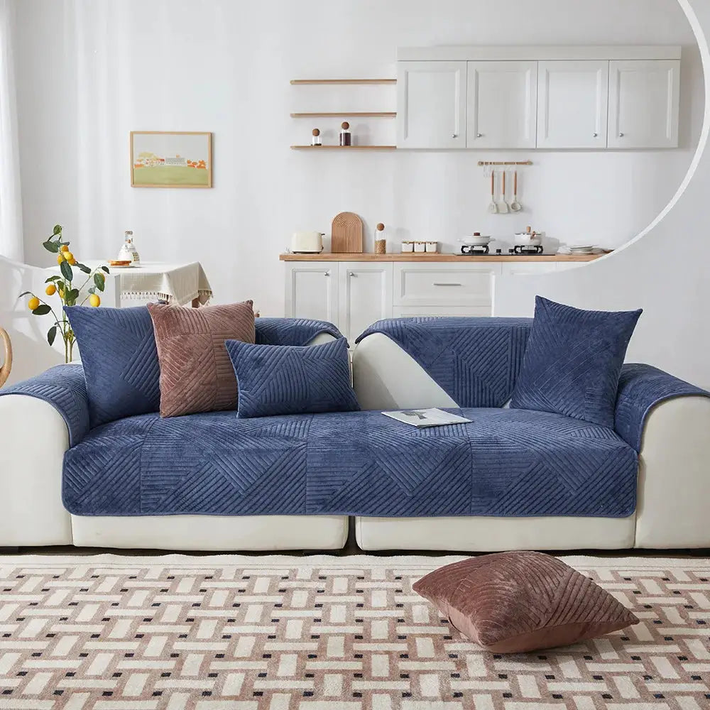 Crystal velvet sofa cover in blue on a white sofa in a modern living room