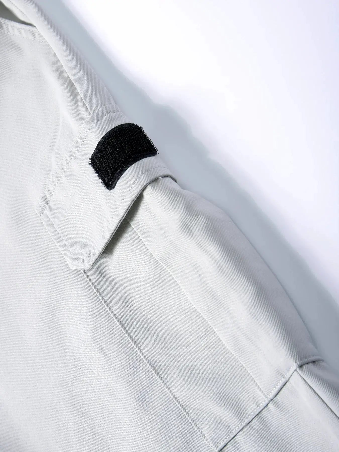 Light gray men's cargo joggers with black Velcro patch and pockets.