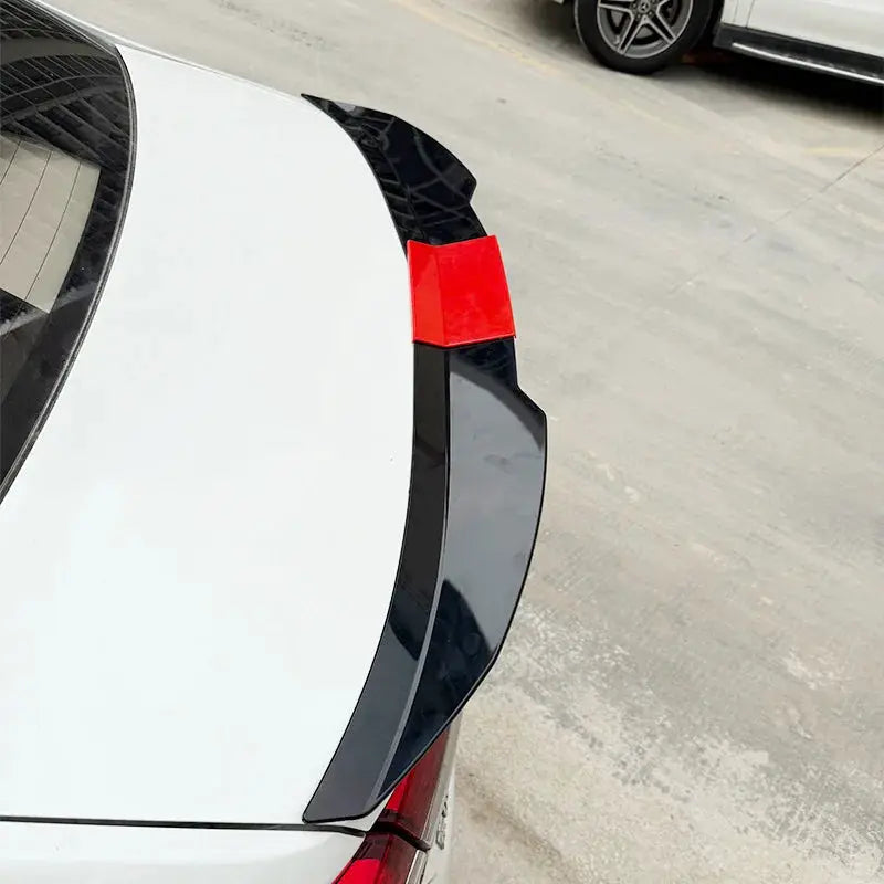 Universal 3-piece rear trunk spoiler wing (117–127cm), black with red mounting cover on white sedan