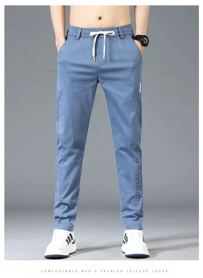 Men's casual pants with elastic drawstring waist in blue by Simples Market, slim straight