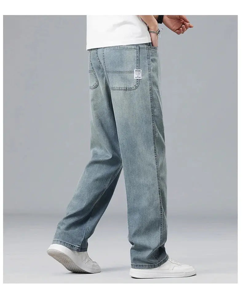 Men's light-wash denim jeans, loose straight fit with back patch pocket and small label.