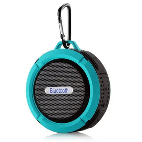 Waterproof wireless portable Bluetooth speaker by Simples Market, round teal and black with carabiner clip
