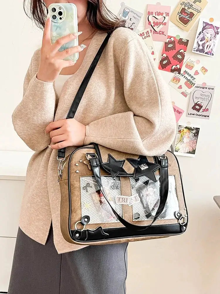 Y2K Star Ita Bag by Simples Market; beige bag with black trim, clear pocket, star accents, crossbody strap