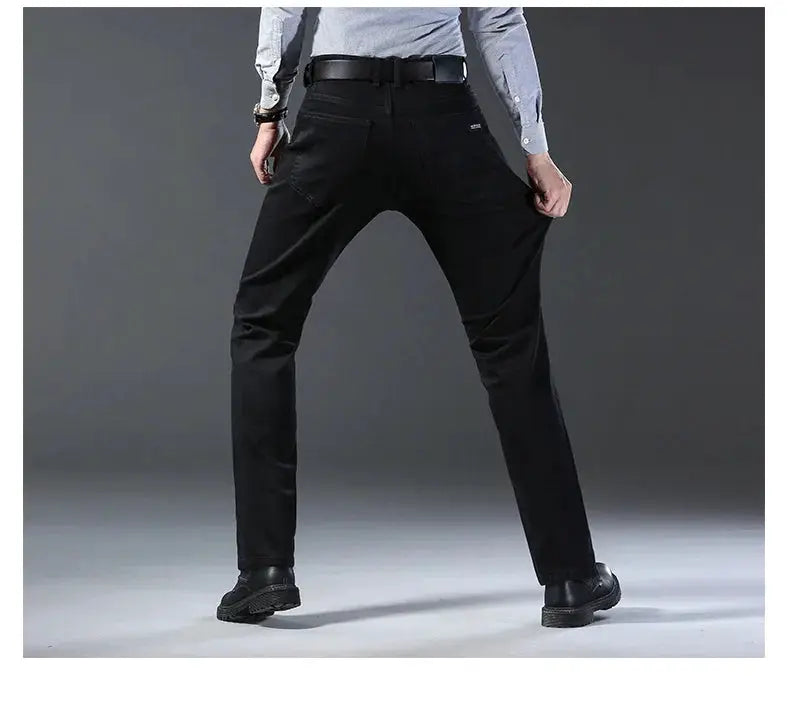 Men's black denim jeans, straight-leg stretch fit, back view with belt